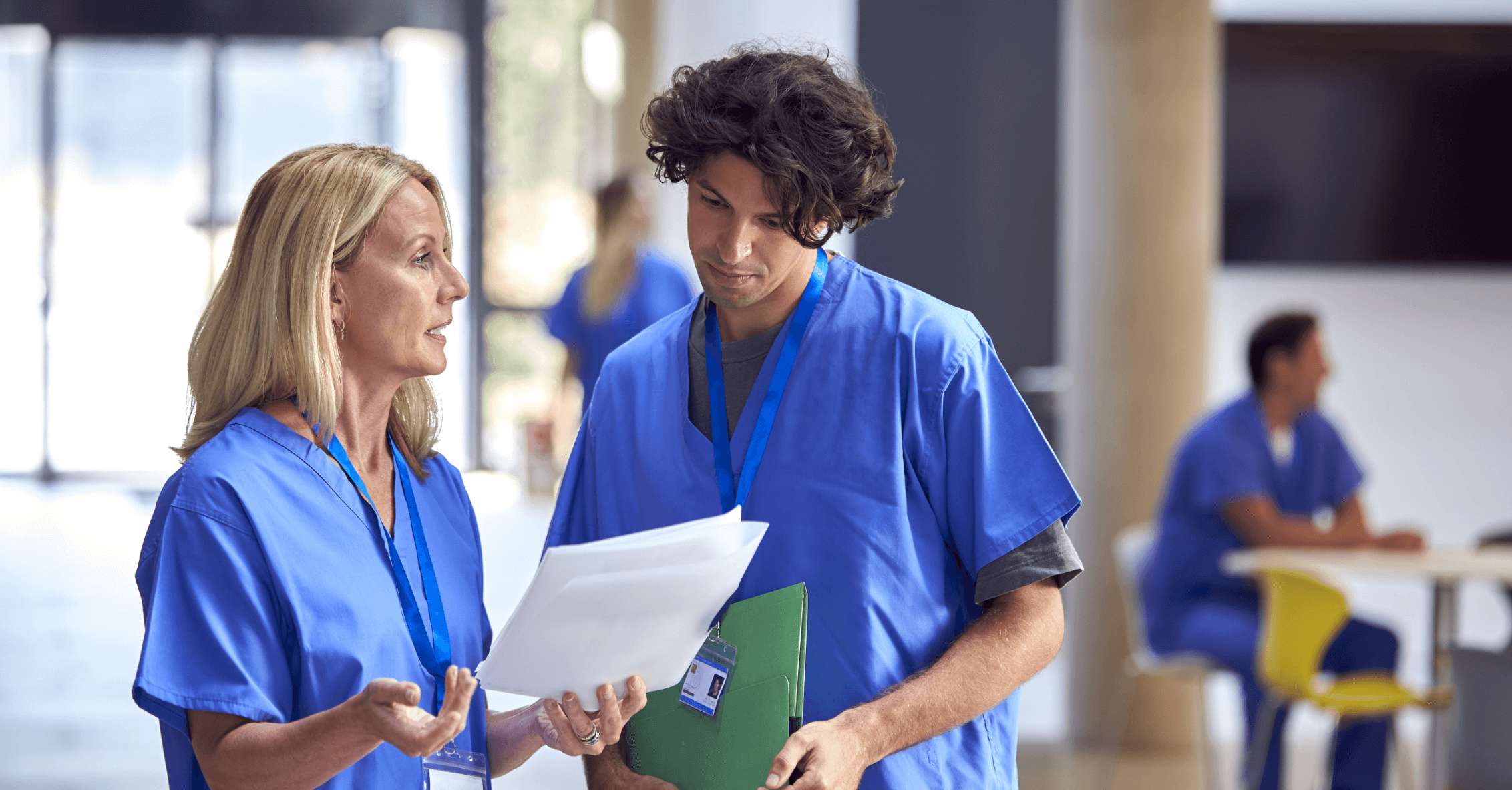 nursing home staff discussing notes