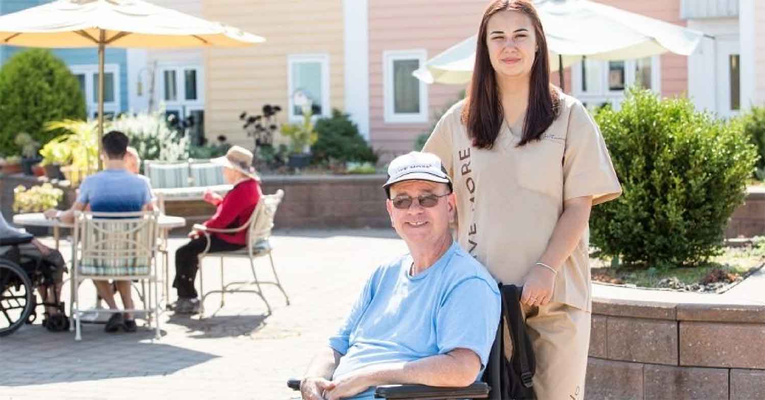 Northwood staff member with a resident in a wheelchair