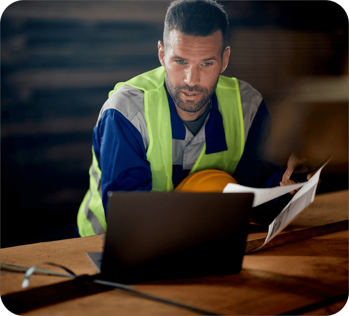 manufacturing employee looking at training on laptop