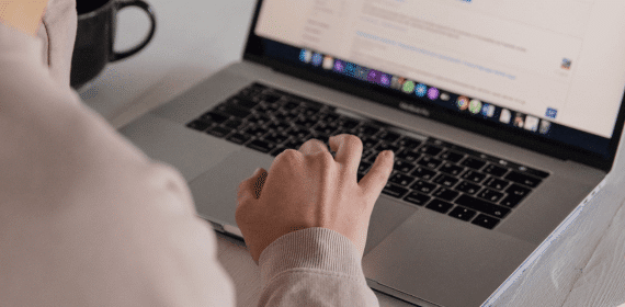 Typing on laptop