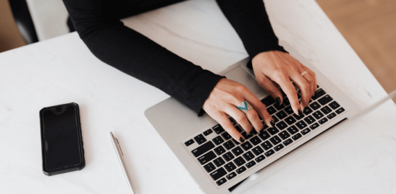 Typing on laptop