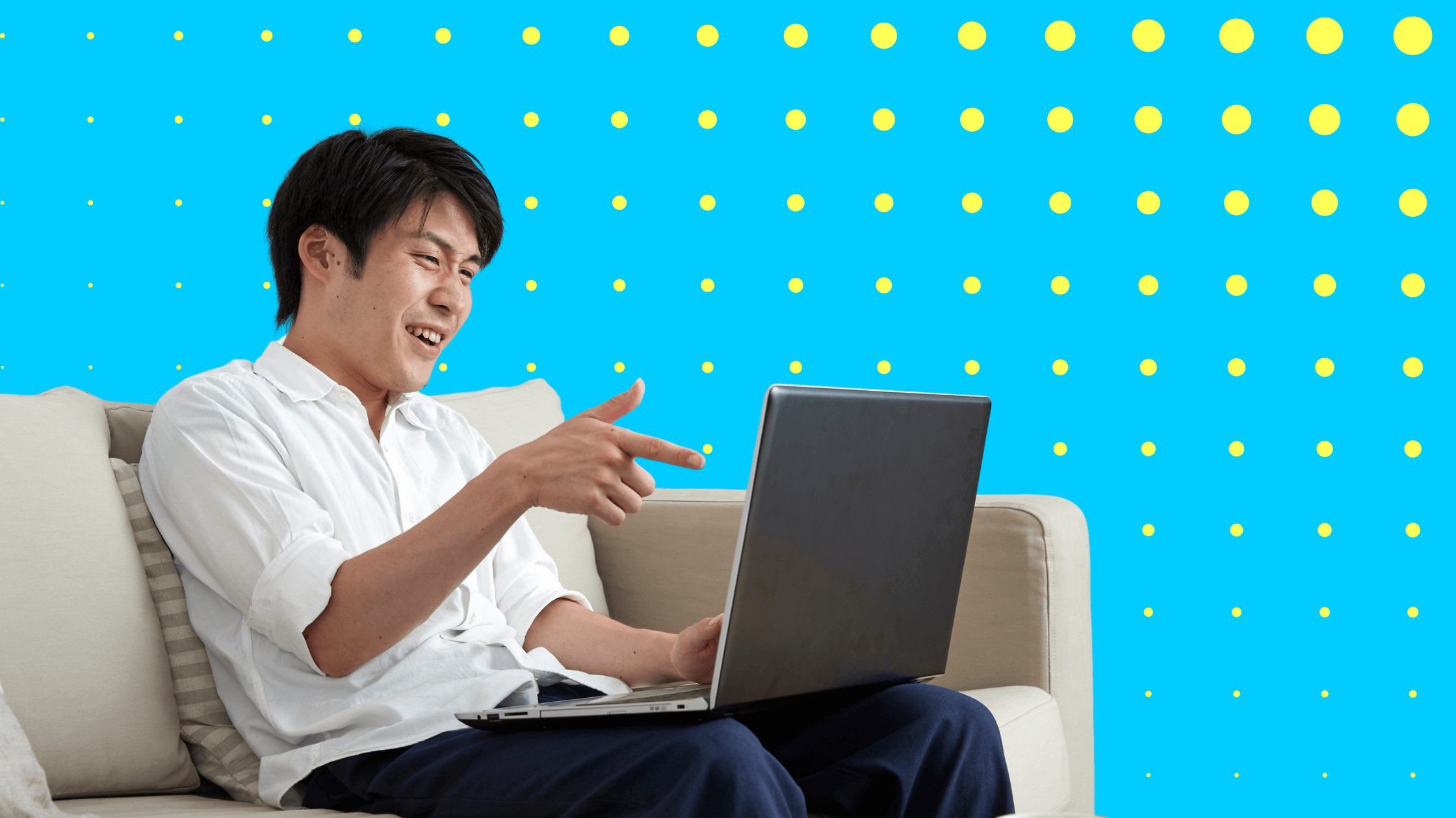 Employee smiling at laptop